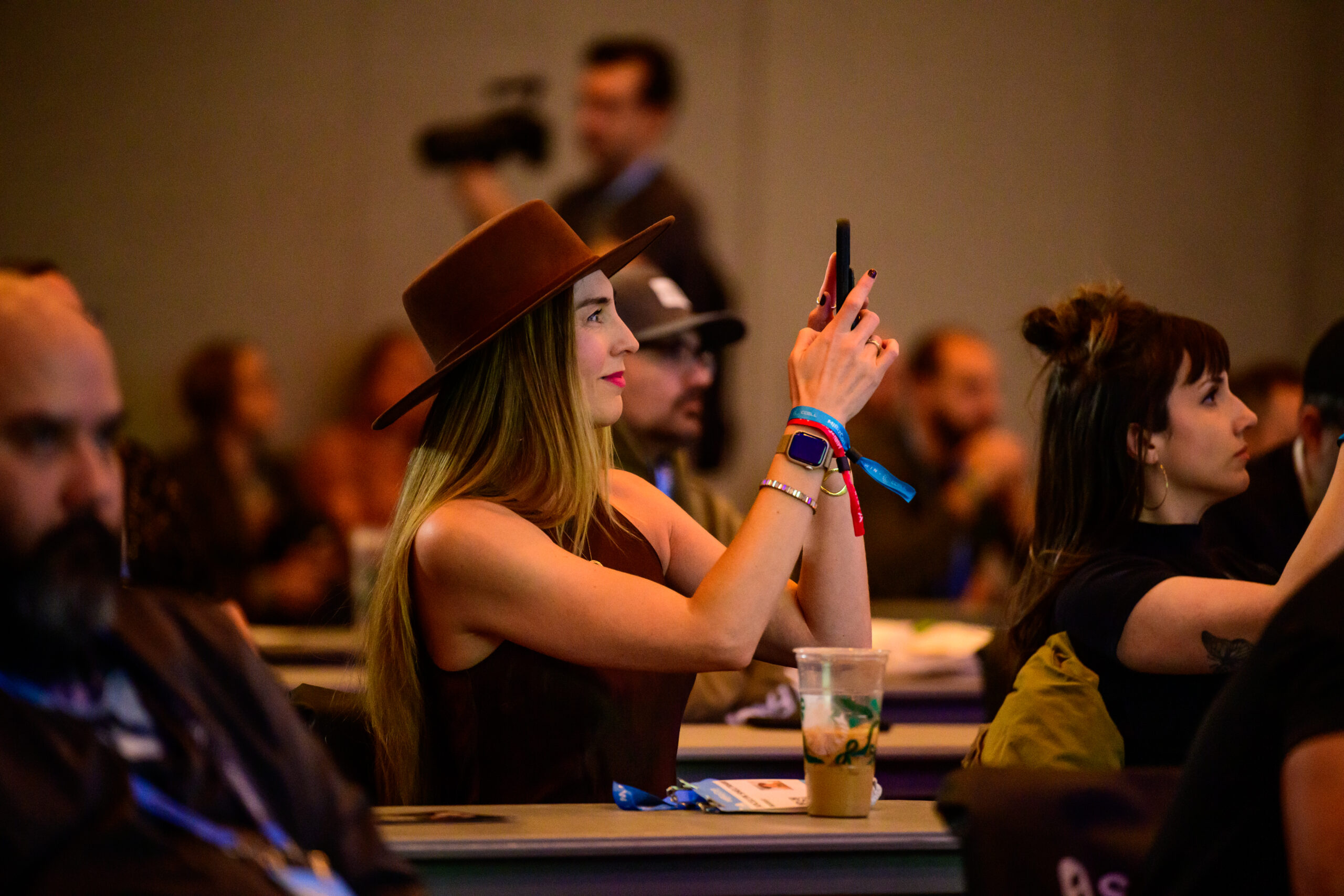 Conference attending participating in cannabis conference sessions at MJBizCon